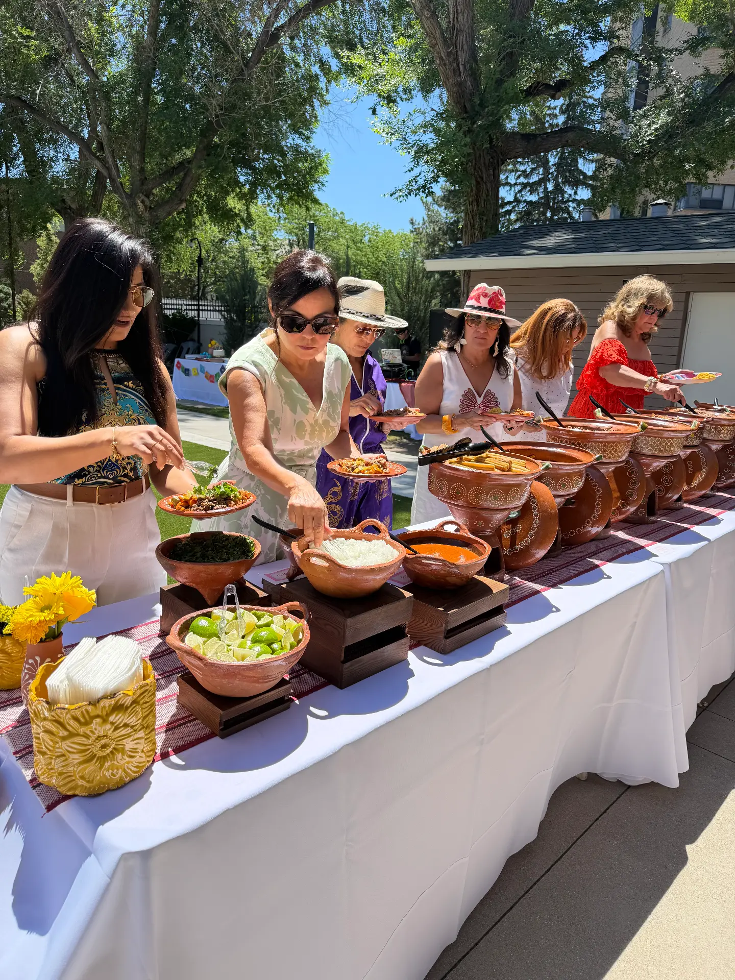 Guests serving themselves from a Combi Taco outdoor buffet